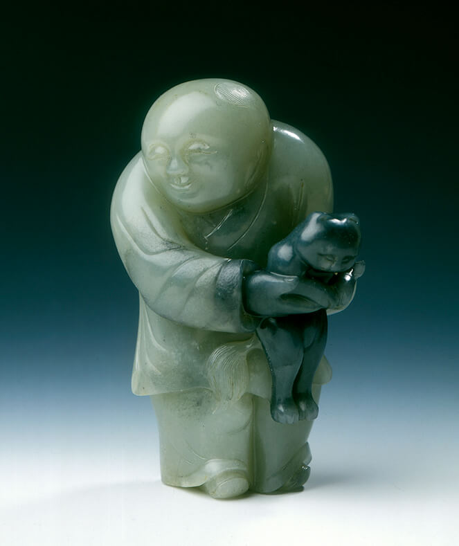 Jade chubby boy holding a black catEarly Ming dynasty (1368-1550) or earlier